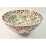 A 20th century Chinese Canton bowl painted butterflies and flowers, 26cm diameter