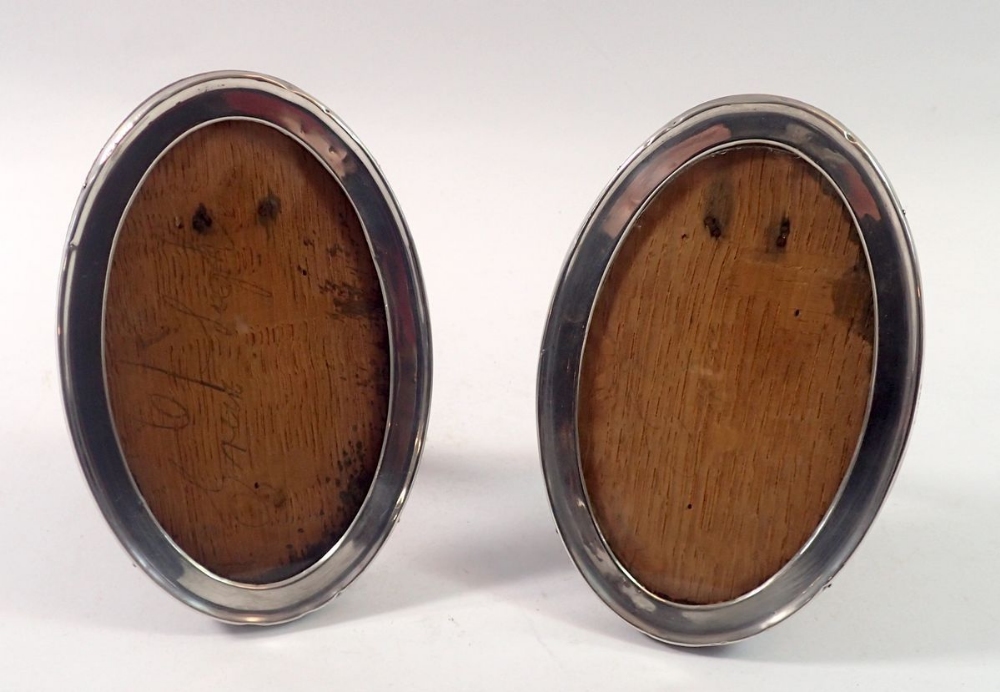 A pair of oval silver photograph frames, 155 x 11cm, Birmingham 1922