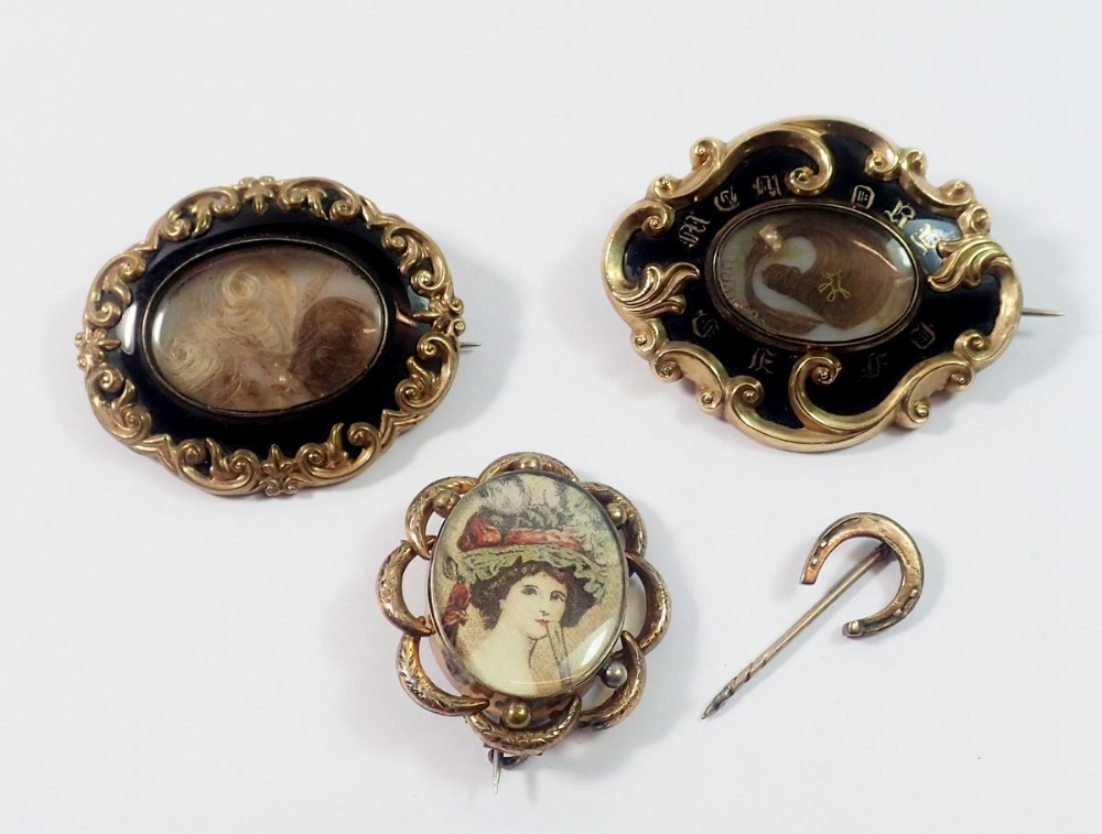 Two Victorian gold and enamel mourning brooches with hair lockets, one dated 1849 5 x 4cm and