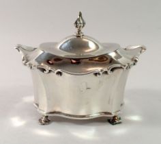 A silver fluted sugar bowl with hinged lid and pad feet, Chester 1902, 198g and a pair of claw