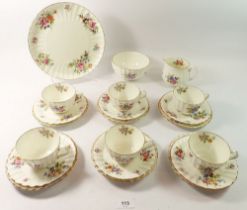 A Royal Worcester Roanoke tea service comprising five cups and six saucers, six tea plates, cake