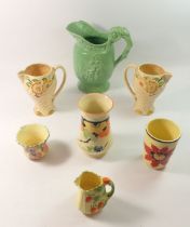 A Shorter & Sons green Daisy jug, two Wade jugs and four various Art Deco vases