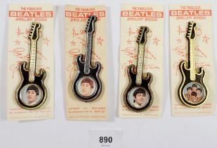 Four 1960's Beatles guitar badges