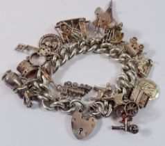 A large silver charm bracelet, 121g total weight