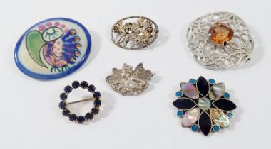 A silver fairy brooch and four other brooches