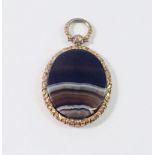 A Victorian gold plated engraved oval pendant set agate, 3.7 x 3.1cm