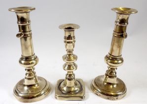 A pair of J Barlow patent brass candlesticks and another Georgian candlestick, 22cm