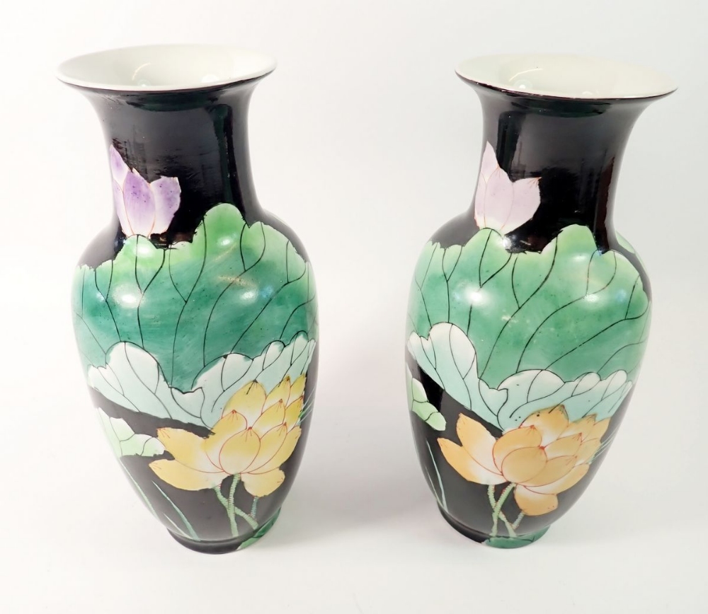A pair of Chinese mid 20th century vases painted waterlilies, 25cm tall