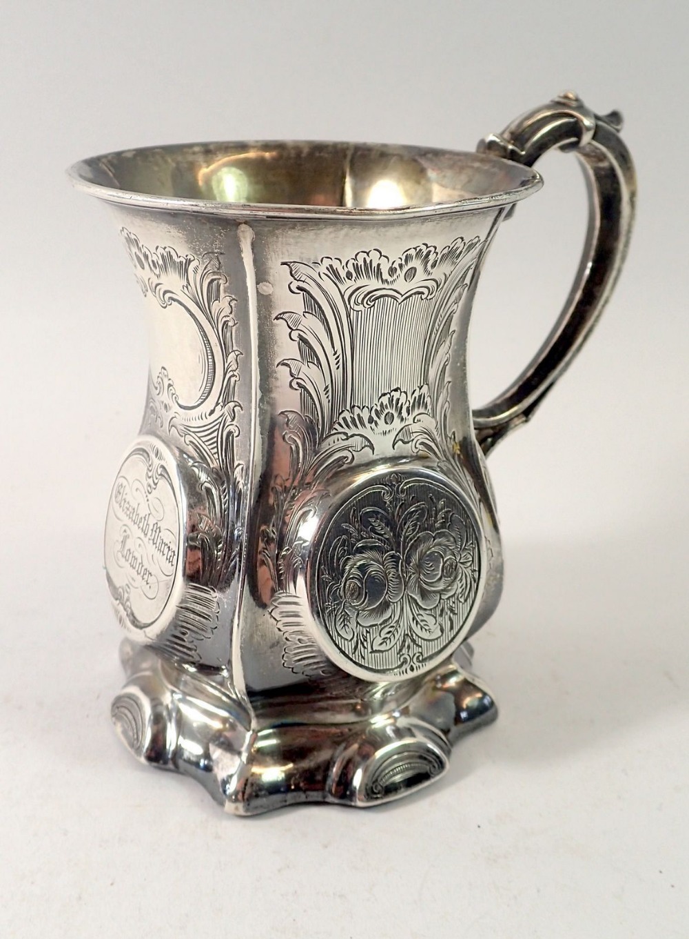 A Victorian silver mug of waisted and fluted form, engraved name, Birmingham 1856, 170g by George