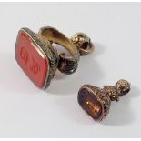 A 19th century gold plated seal set cornelian engraved monogram and a smaller one 'God Bless You'