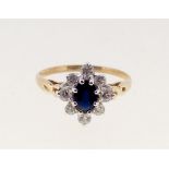 A 9 carat gold sapphire and white stone cluster ring, size M to N, 1.8g