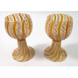 A pair of latticino small yellow and white wine glasses, 10cm tall