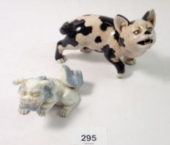 A Japanese porcelain model cat, 13cm and a Kylin dragon