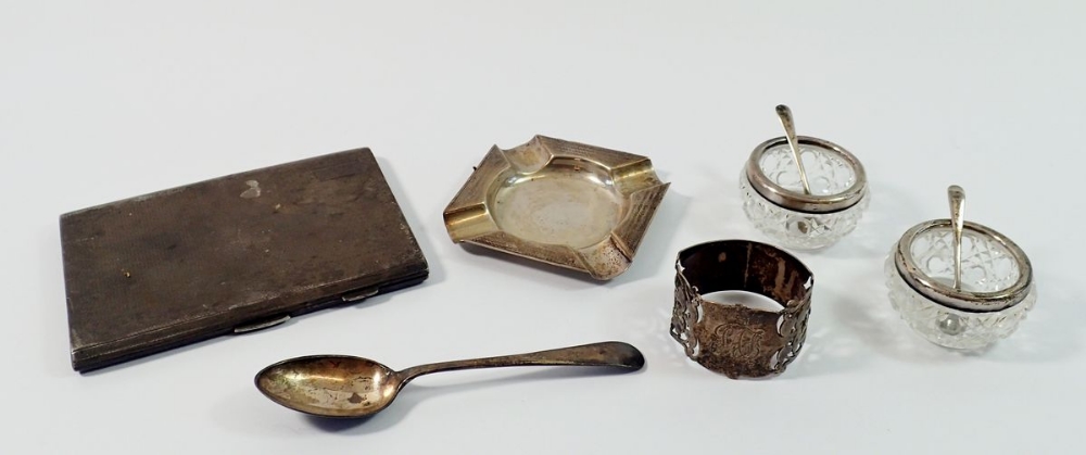 A group of silver including cigarette case, ash tray, teaspoon, napkin ring and pair of silver