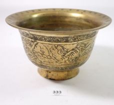 A Chinese brass bowl decorated Dog of Fo, with seal mark to base, 21cm diameter