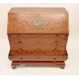 A fine Edwardian Sheraton revival bureau of bombe form with all over floral painted decoration and
