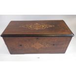 A Swiss musical box in marquetry case with cylinder movement playing six airs, 48cm wide