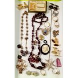 A box of costume jewellery including three silver rings, silver crucifix and other silver etc.