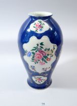 A blue and gold Worcester style vase with floral relief panels, base marked 877/4527, 27cm tall