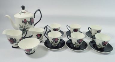 A Royal Albert Masquerade coffee set comprising coffee pot, six cups and saucers, milk and cream