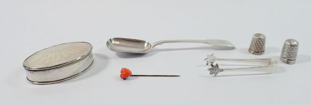 A silver sugar shovel, a pair of silver sugar tongs, two silver thimbles, a white metal mounted