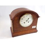 An oak 1920's mantel clock with enamel dial, 24cm tall