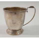 A silver Art Deco christening mug engraved 'L', Birmingham 1936 Selfridges & Co Ltd. 104g