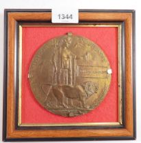 A WWI death plaque for William Cawley - mounted in a frame