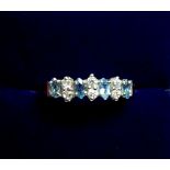 A 9 carat gold ring set aquamarines and cubic zirconium, size M -N, 1.9g