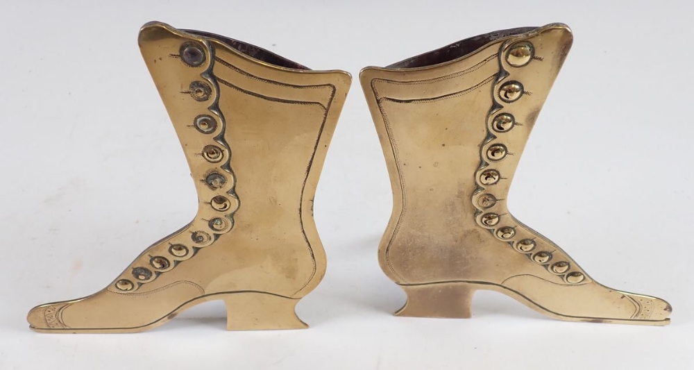 A pair of Victorian brass boot form spill vases, 17cm tall