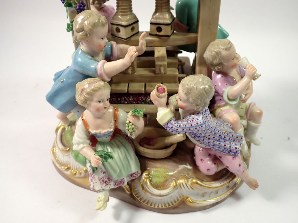 A 19th century Meissen group of children playing around a wine press, crossed swords mark to base, - Image 6 of 7