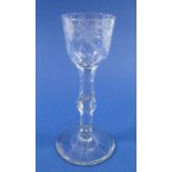 An antique wine glass with facet cut stem and bowl engraved bird and flowers, 15.5cm