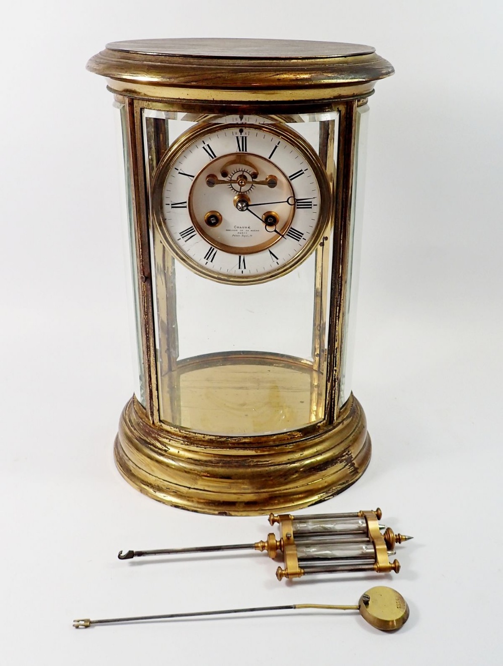 A fine 19th century French oval four glass mantel clock with mercury compensated pendulum by Chaude,