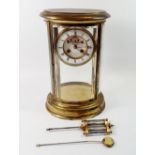 A fine 19th century French oval four glass mantel clock with mercury compensated pendulum by Chaude,