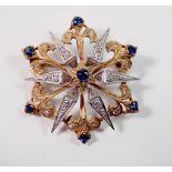 A 9ct gold star form brooch/pendant set diamonds and sapphires, 6g