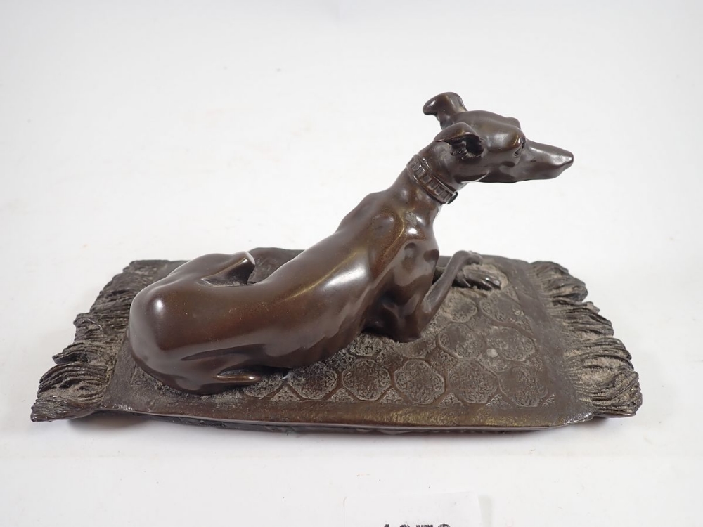 A bronze finish group recumbent whippet on rug, 19cm wide 'OFA' monogram - Image 2 of 3