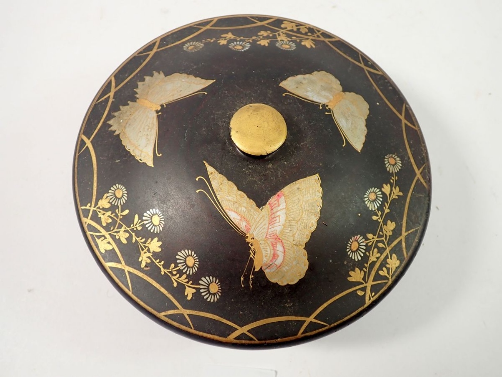A Japanese circular black lacquer box painted butterflies, 17cm diameter and a carved wood - Image 2 of 4