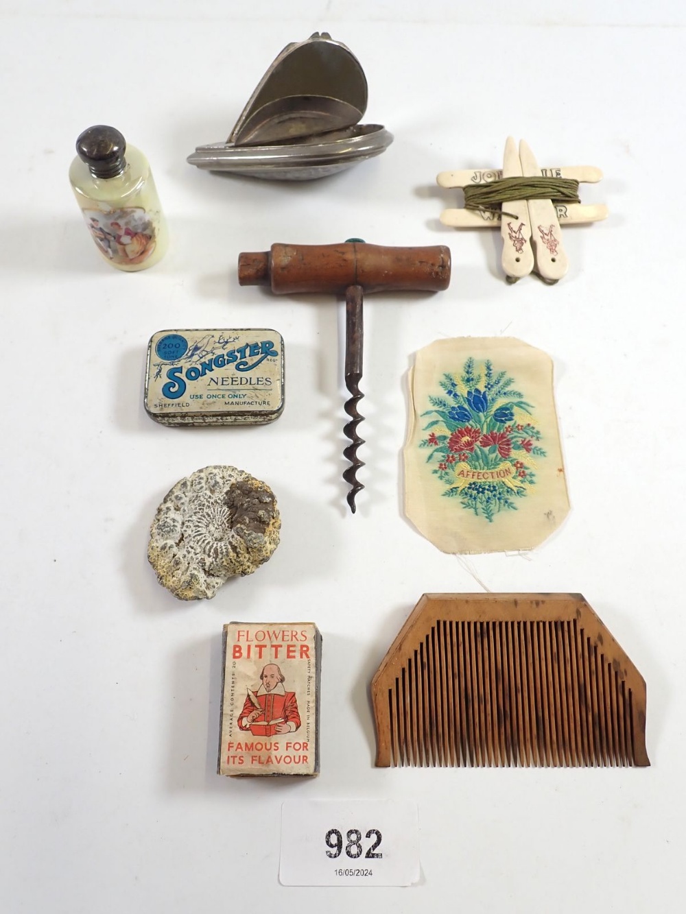 A box of small collectables including snuff box, scent bottle, corkscrew etc.