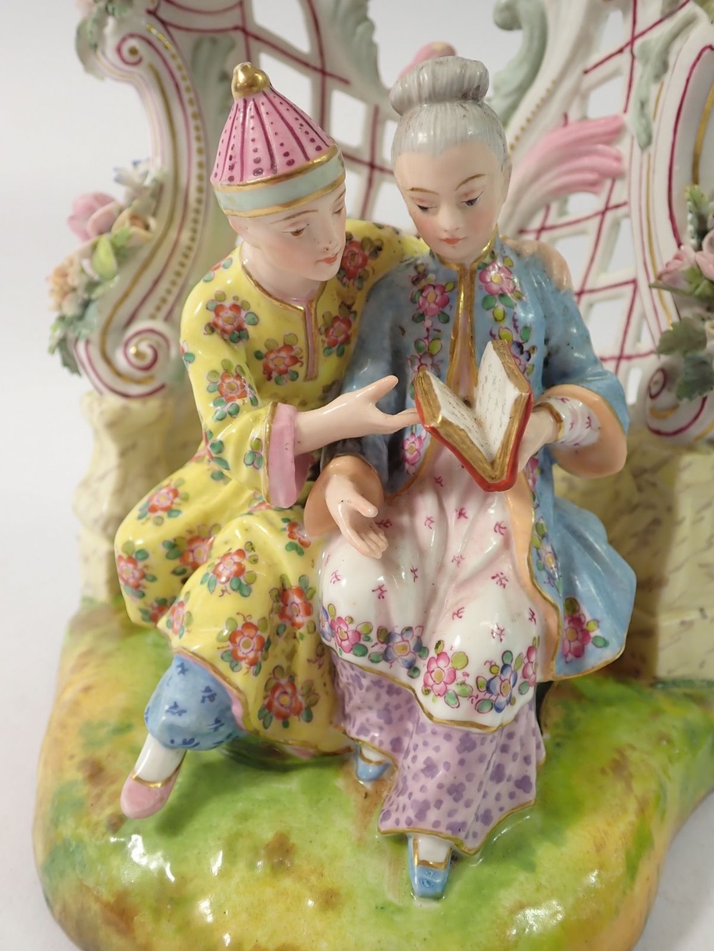 A 19th century Meissen style group of Chinese couple seated reading in floral and scrollwork - Image 2 of 6