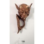 A Roger Roberts pottery devil mask wall plaque, 15cm