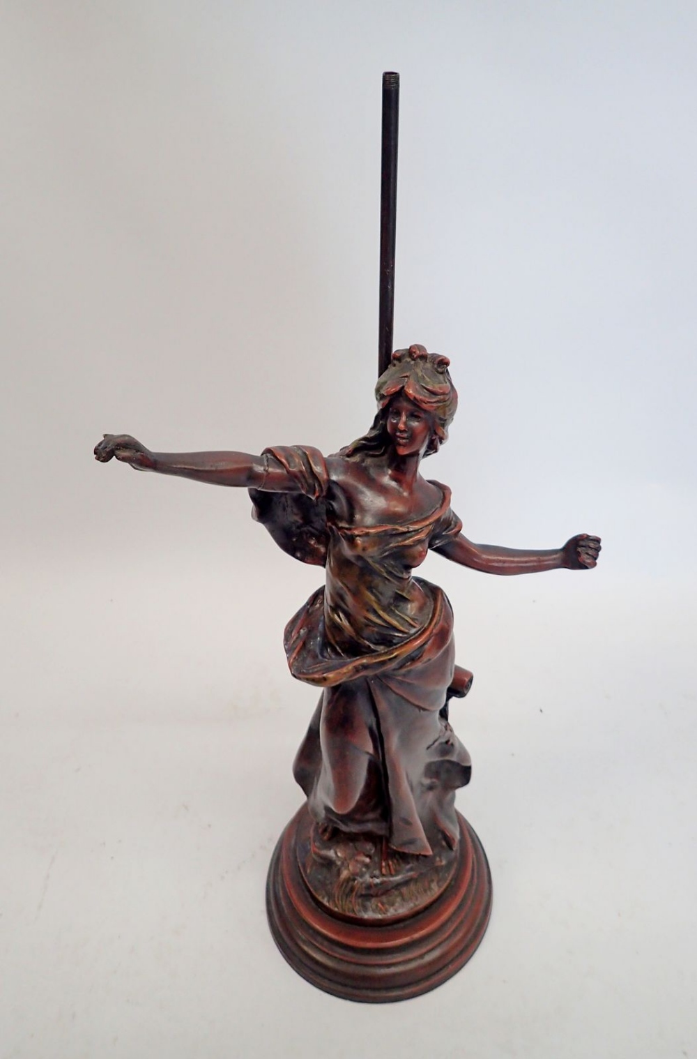 A bronze lamp base figure of a woman after Auguste Moreau (now lacking lamp fitting) 56cm tall,