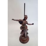 A bronze lamp base figure of a woman after Auguste Moreau (now lacking lamp fitting) 56cm tall,