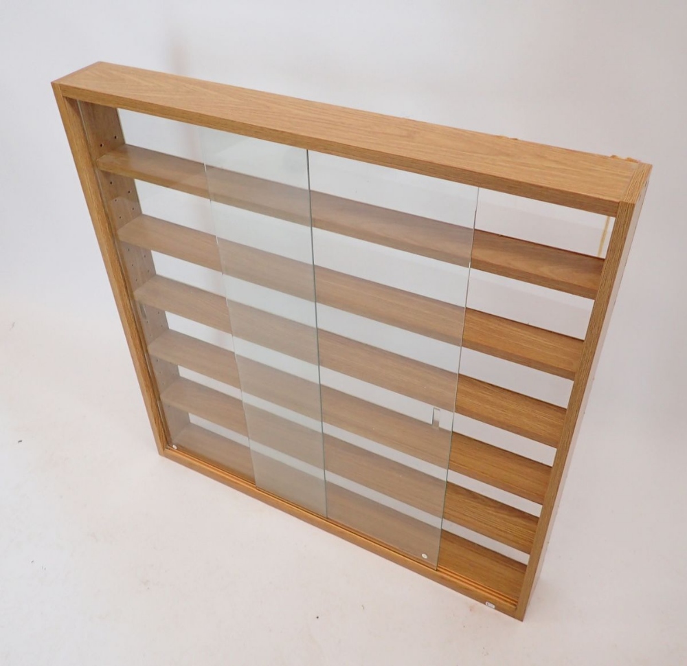 A large wood finish collectors wall cabinet with glass sliding doors, 80 x 80cm - Image 2 of 2