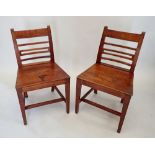 A pair of Georgian mahogany bar back chairs with solid seats