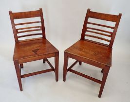 A pair of Georgian mahogany bar back chairs with solid seats