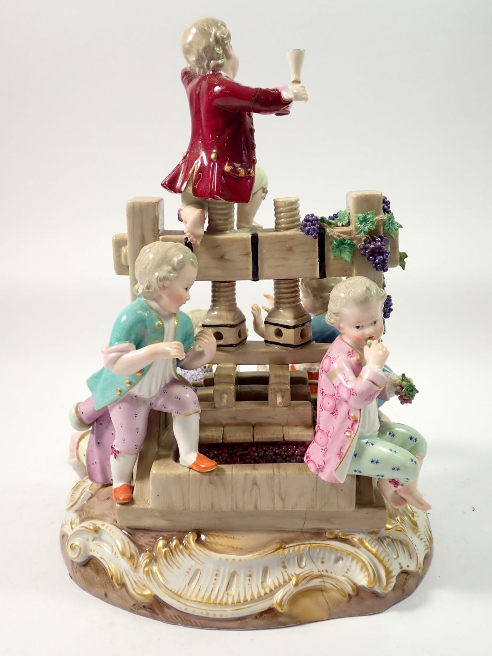 A 19th century Meissen group of children playing around a wine press, crossed swords mark to base, - Image 4 of 7