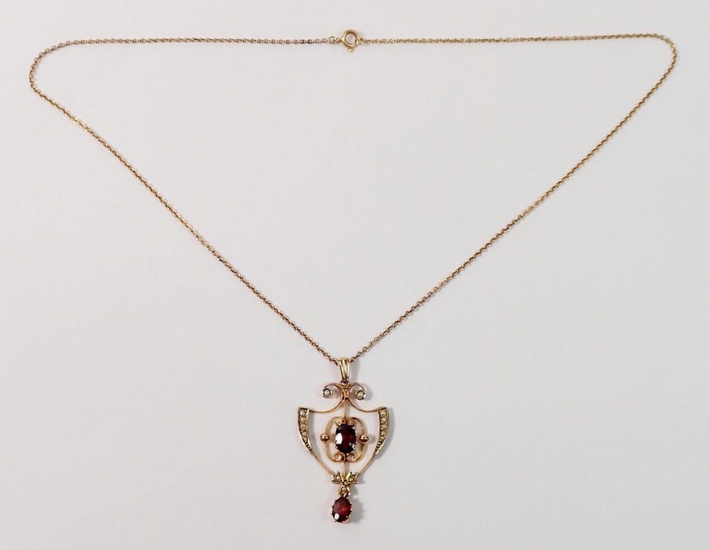 An Edwardian Art Nouveau openwork pendant set garnets and seed pearls, 4cm drop on 9 carat gold - Image 2 of 2