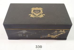 A Japanese Komai style cigarette box decoration armorial to lid and landscape to sides, by M