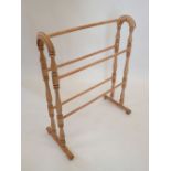 A lightwood towel rail, 63cm wide