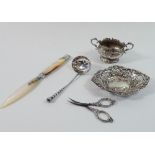 A silver pierced trinket dish, Birmingham 1886, silver scissors, Birmingham 1904, sifter spoon,